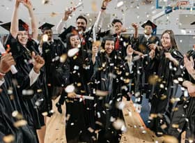 Fresh Graduates Celebrating in Gym